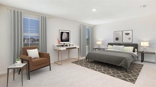 a bedroom with furniture and a flat screen tv