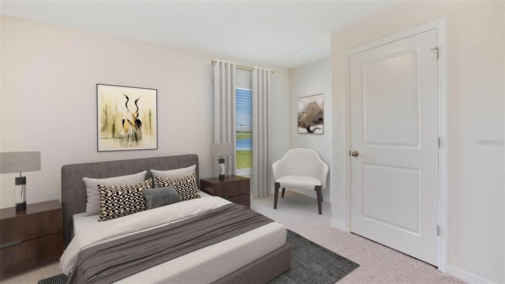 3022 Rock Sound Street Bradenton, FL 34208 - Photo 13 of 13 a bedroom with a bed and a painting on the wall