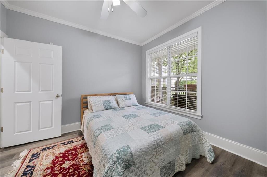 4100 Paces Walk Southeast, Unit 1101 Atlanta, GA 30339 - Photo 21 of 36 a bedroom with a bed and a window