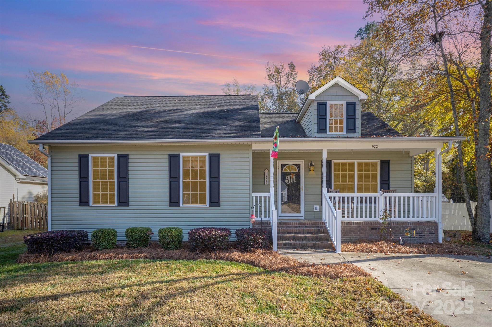 front view of a house with a yard