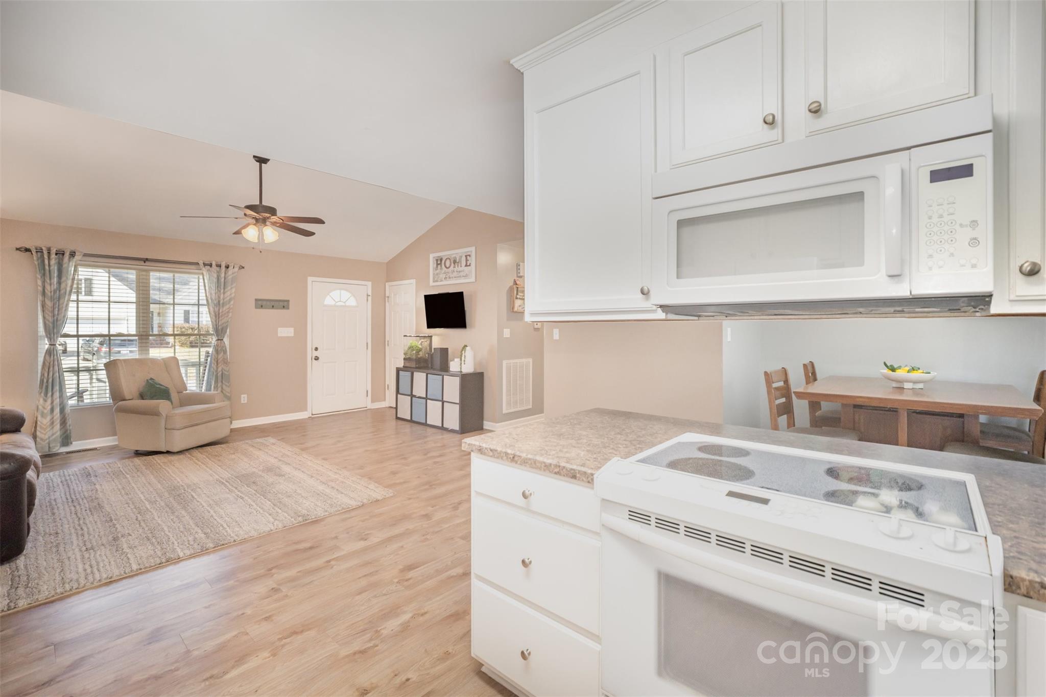 522 Kittiewake Lane Clover, SC 29710 - Photo 15 of 33 a kitchen with granite countertop a sink and a stove top oven