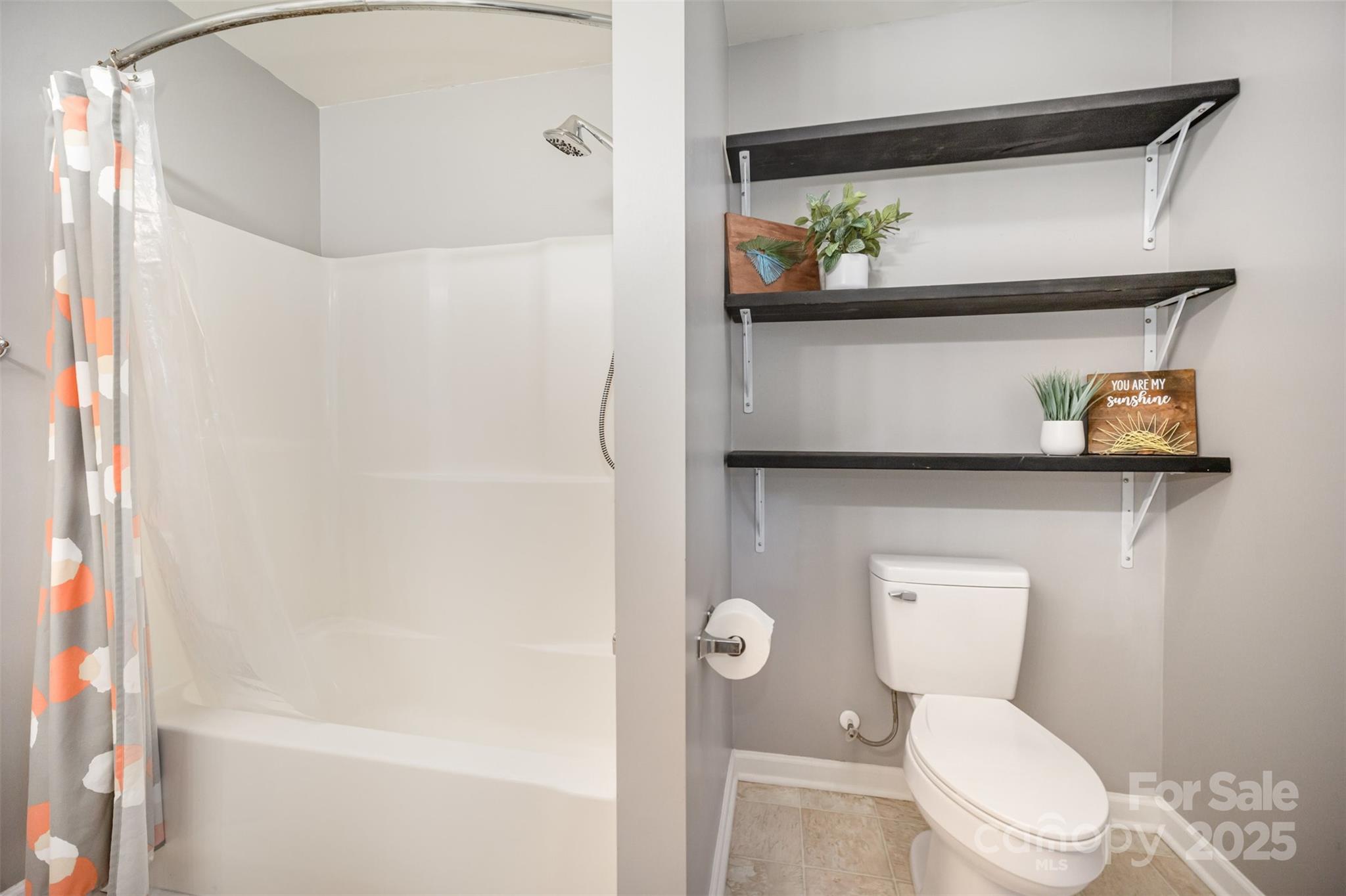 522 Kittiewake Lane Clover, SC 29710 - Photo 21 of 33 a white toilet sitting next to a bathroom sink