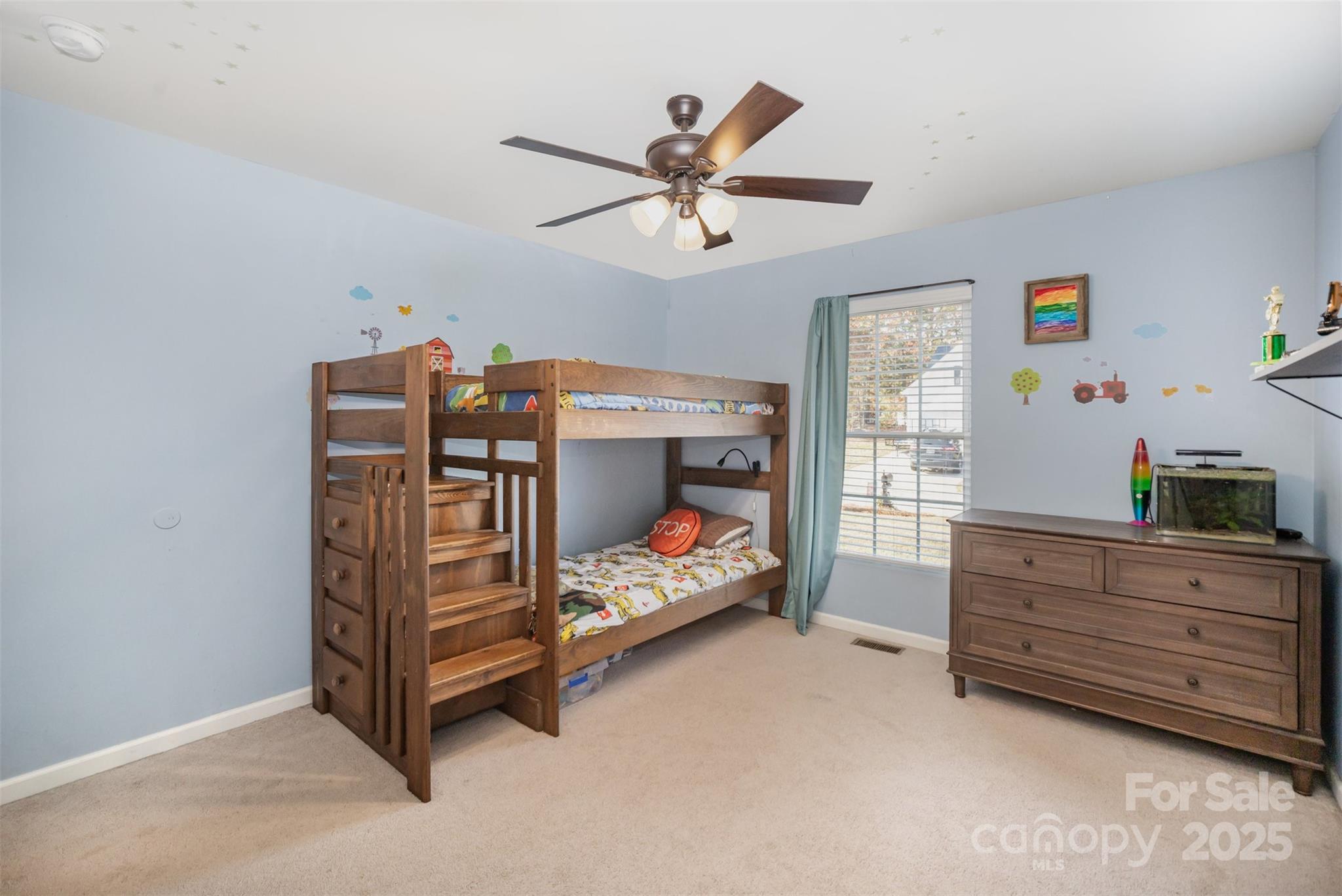 522 Kittiewake Lane Clover, SC 29710 - Photo 22 of 33 a bedroom with a bed and a chandelier