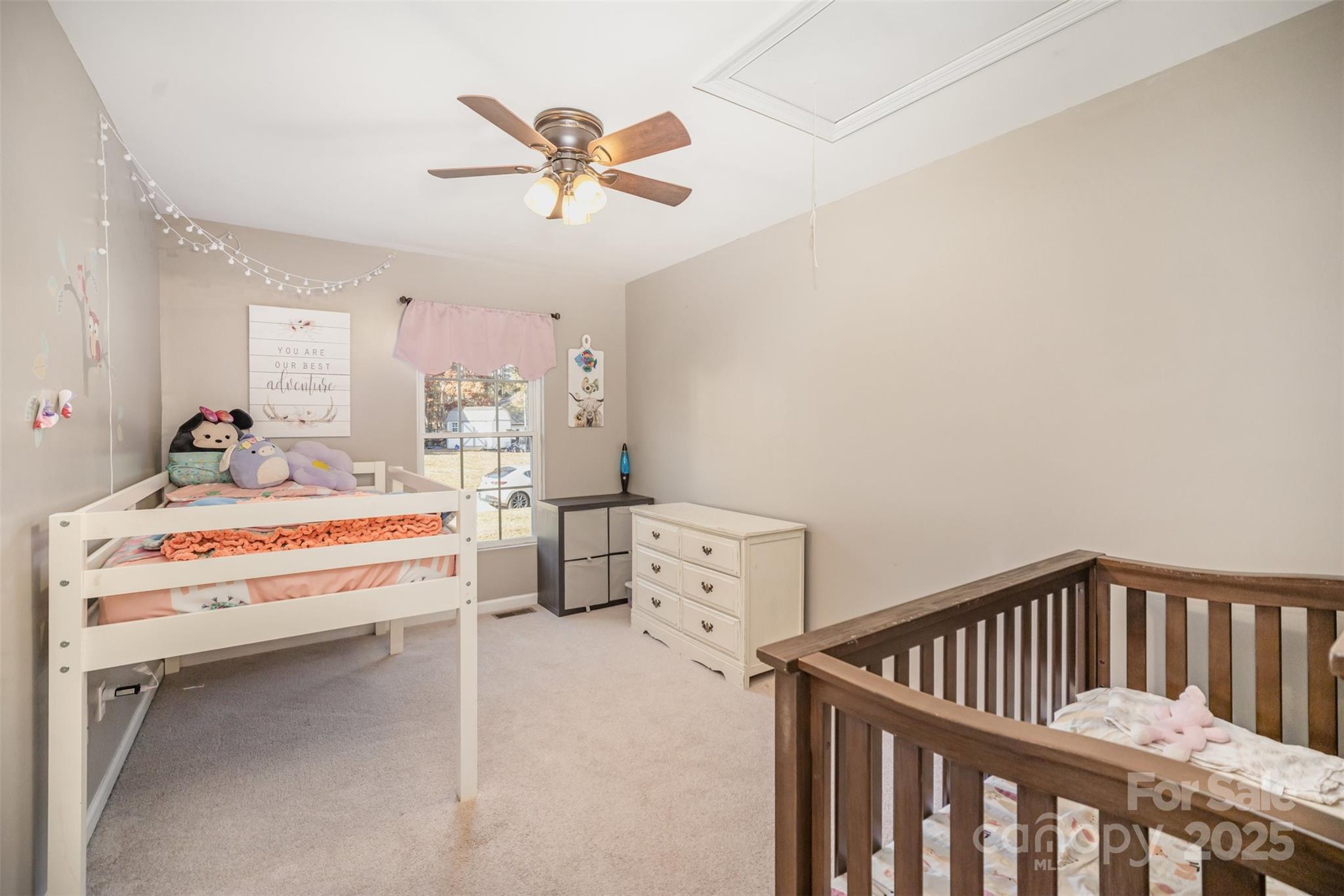522 Kittiewake Lane Clover, SC 29710 - Photo 23 of 33 a bedroom with a bed and a chandelier