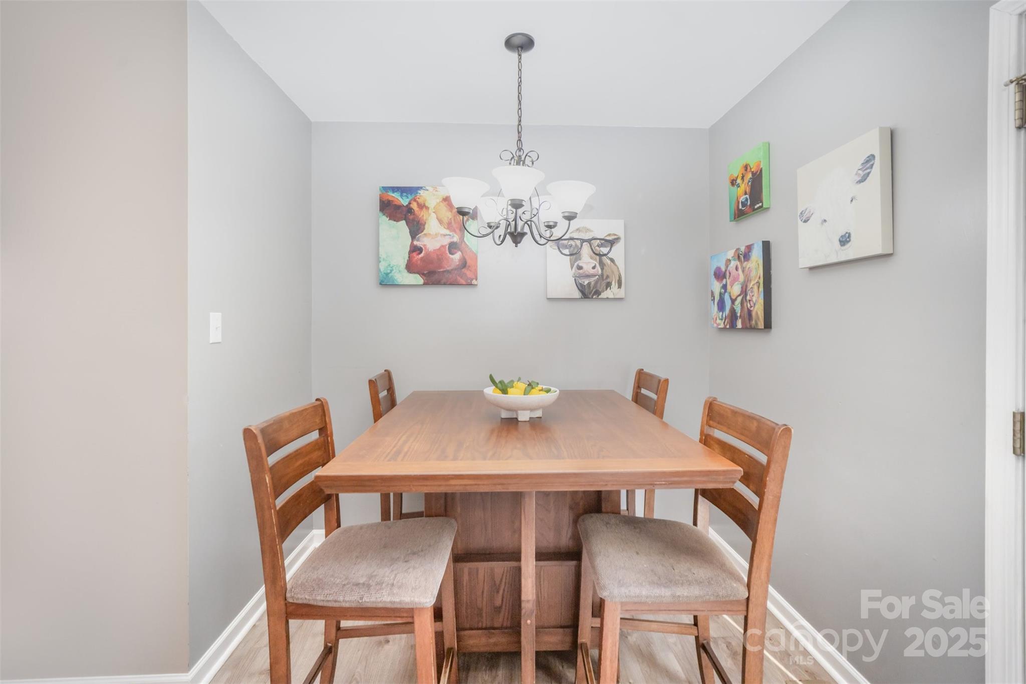 522 Kittiewake Lane Clover, SC 29710 - Photo 9 of 33 a view of a dining room with furniture and wooden floor