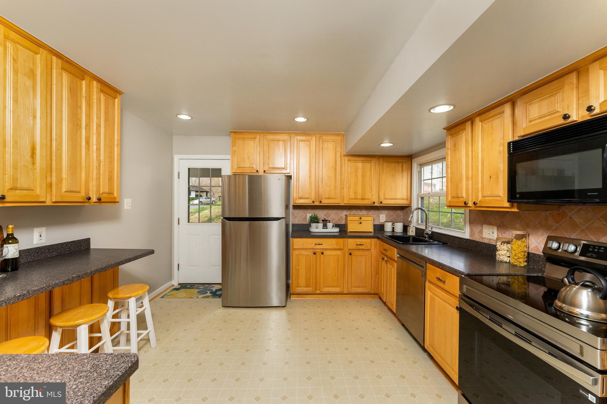 7013 Galgate Drive Springfield, VA 22152 - Photo 6 of 57 KITCHEN WITH CONVENIENT DOOR TO CARPORT