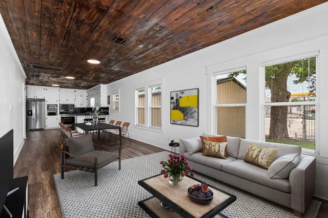 a living room with furniture and a table