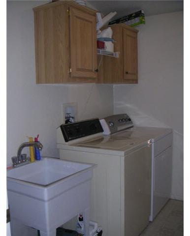 20591 Bee Valley Road Jamul, CA 91935 - Photo 7 of 9 Laundry with utility sink