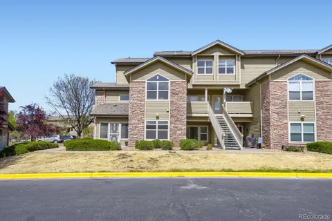 a view of a house with swimming pool and a yard