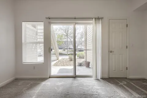 a view of an empty room and window