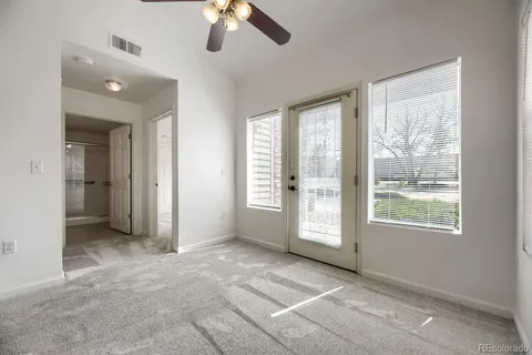 a view of an empty room with a window