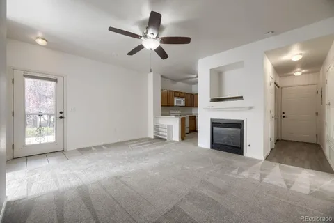 a view of empty room with a fireplace