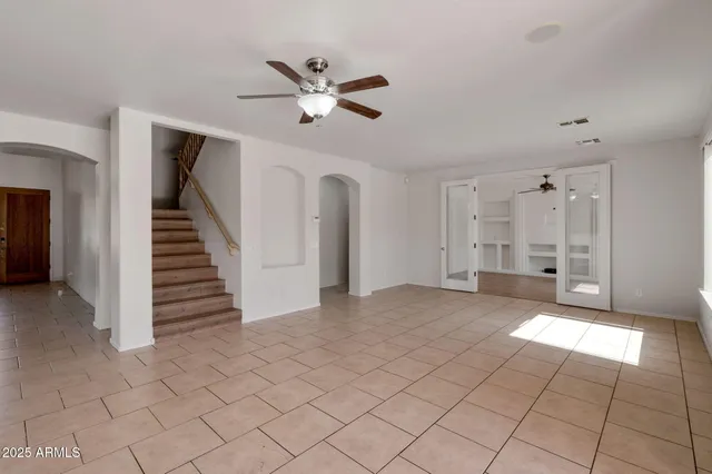 a kitchen with stainless steel appliances granite countertop a refrigerator stove top oven and sink