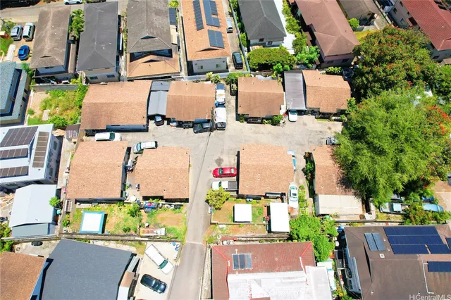 an aerial view of residential houses with outdoor space