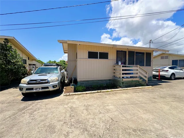 a car parked in front of a house