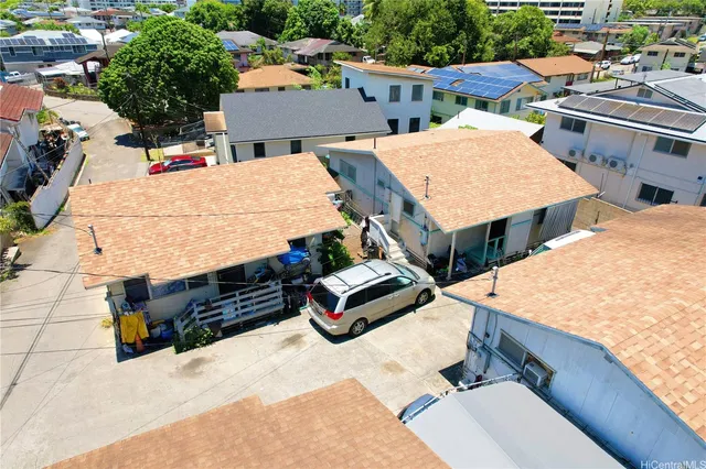 an aerial view of residential houses with outdoor space