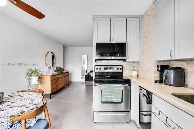 a bed room with a bed and a potted plant