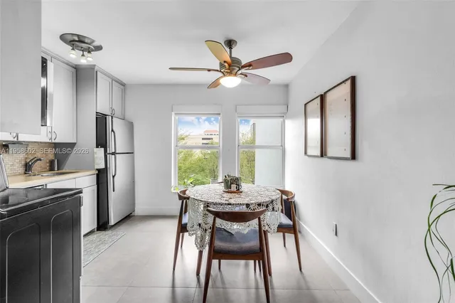a living room with furniture flat screen tv and wooden floor
