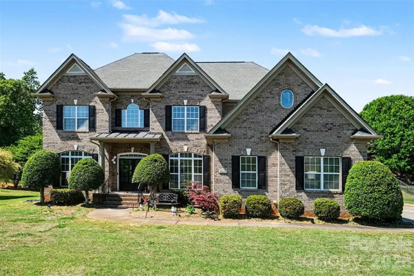 front view of a house with a yard