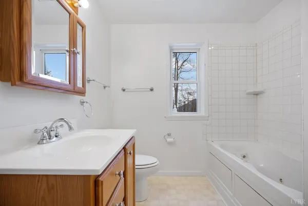 a view of a dry yard with mountains in the background