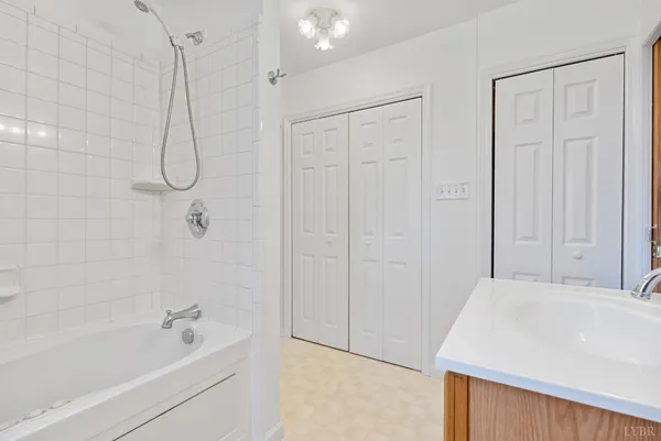 a view of a dry yard with mountains in the background