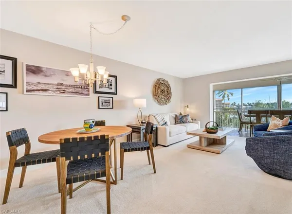 a view of a livingroom with furniture and window