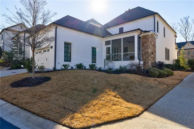 a view of an entryway with wooden floor and a livingroom