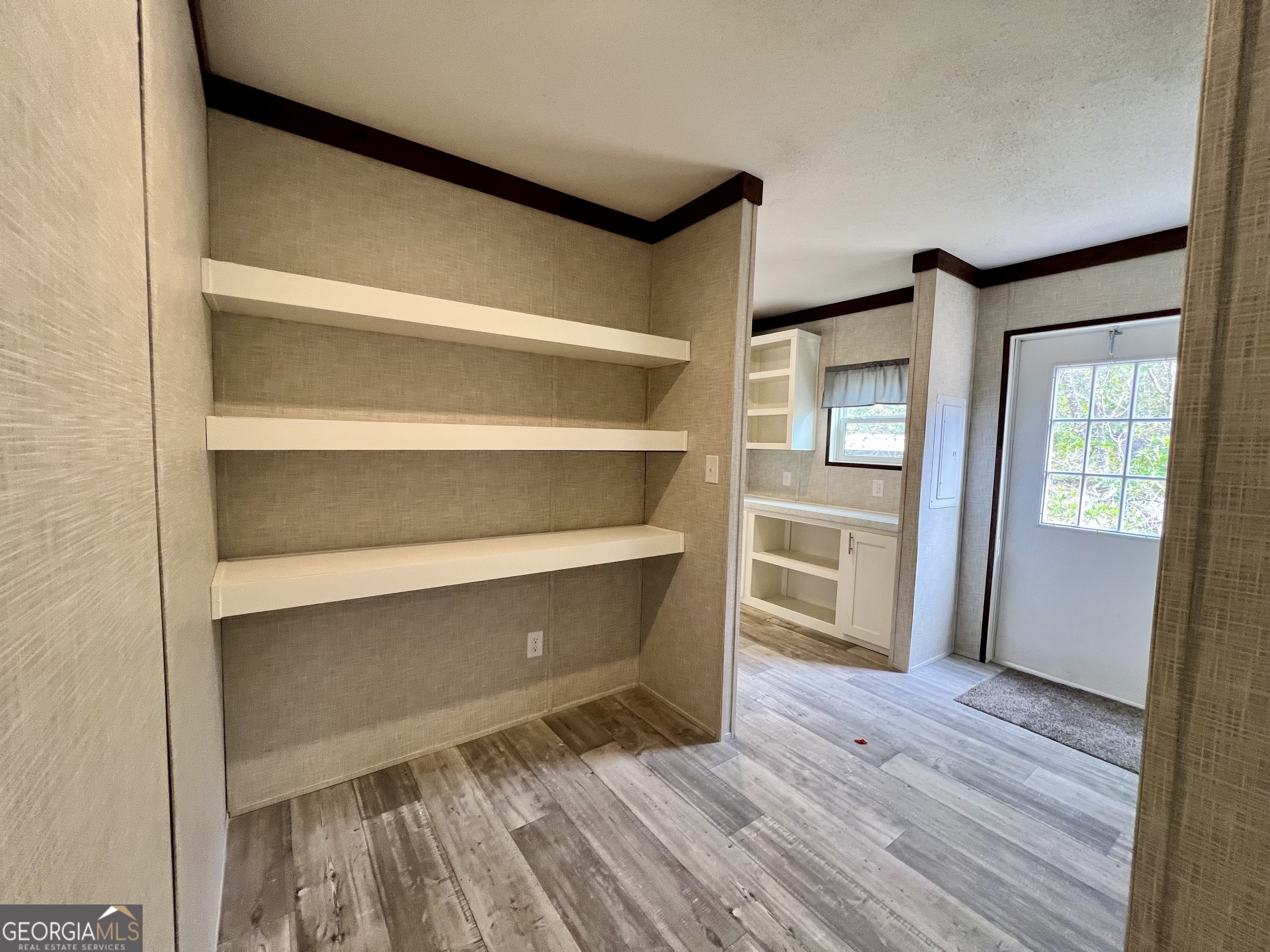 223 Pelican Road Woodbine, GA 31569 - Photo 16 of 18 a view of walk in closet with empty racks