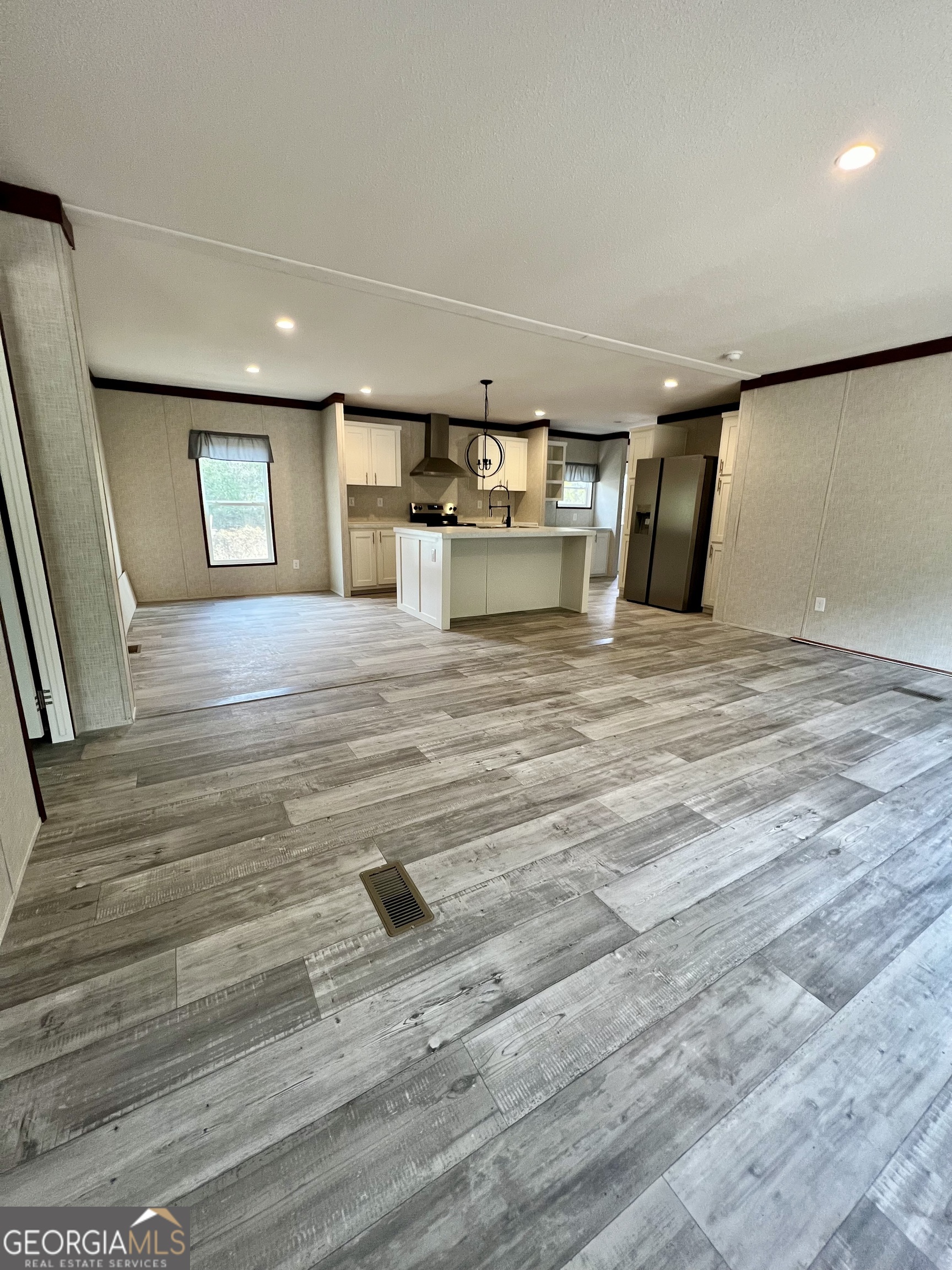 223 Pelican Road Woodbine, GA 31569 - Photo 3 of 18 a view of empty room with wooden floor