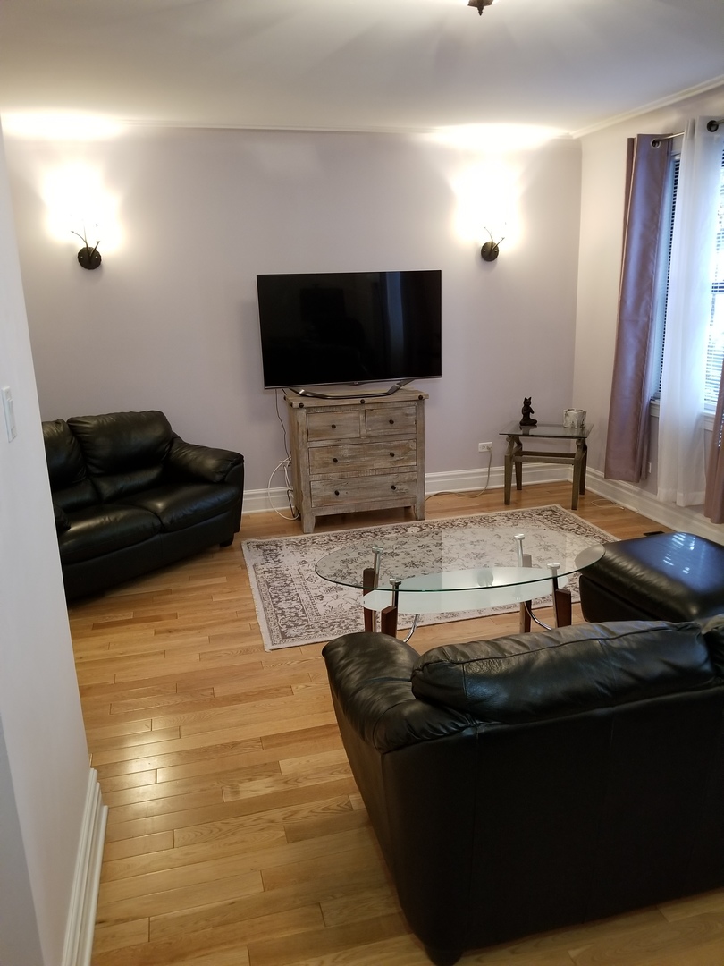 433 West Briar Place, Unit 1D Chicago, IL 60657 - Photo 3 of 12 a kitchen with a sink and a stove top oven