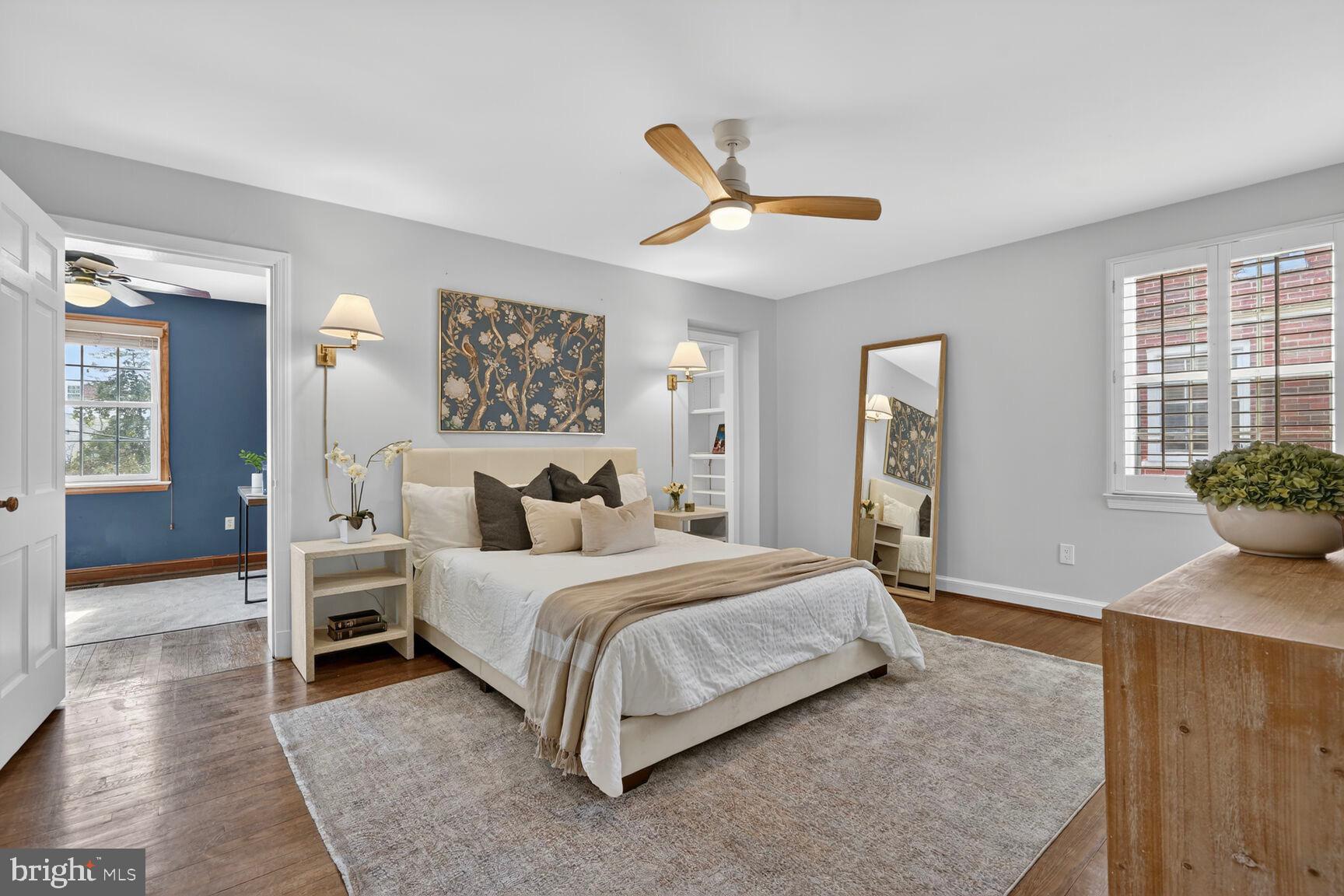 3262 Aberfoyle Place Northwest Washington, DC 20015 - Photo 26 of 64 a bedroom with a bed and a chandelier