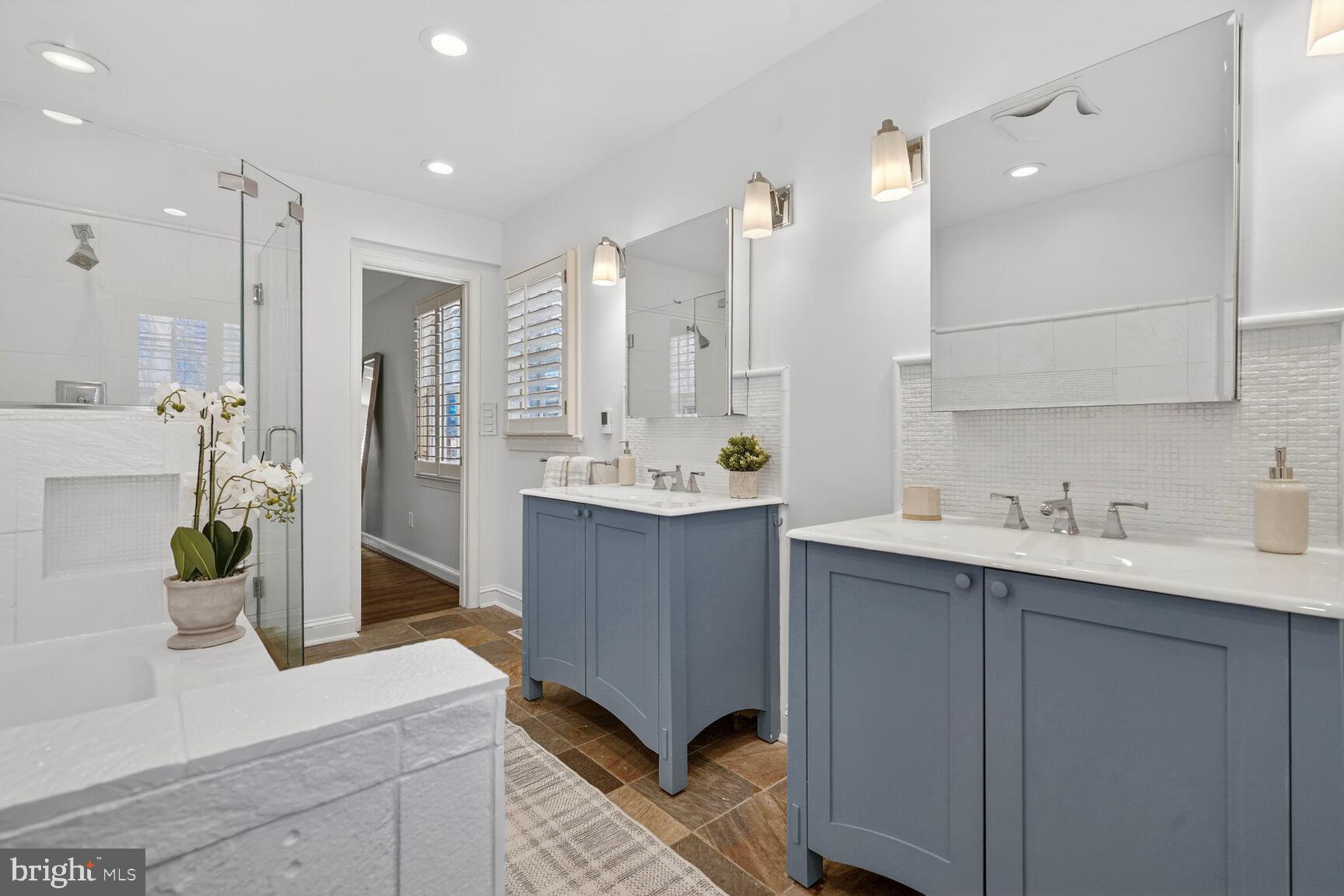 3262 Aberfoyle Place Northwest Washington, DC 20015 - Photo 30 of 64 a bathroom with a sink double vanity and a mirror