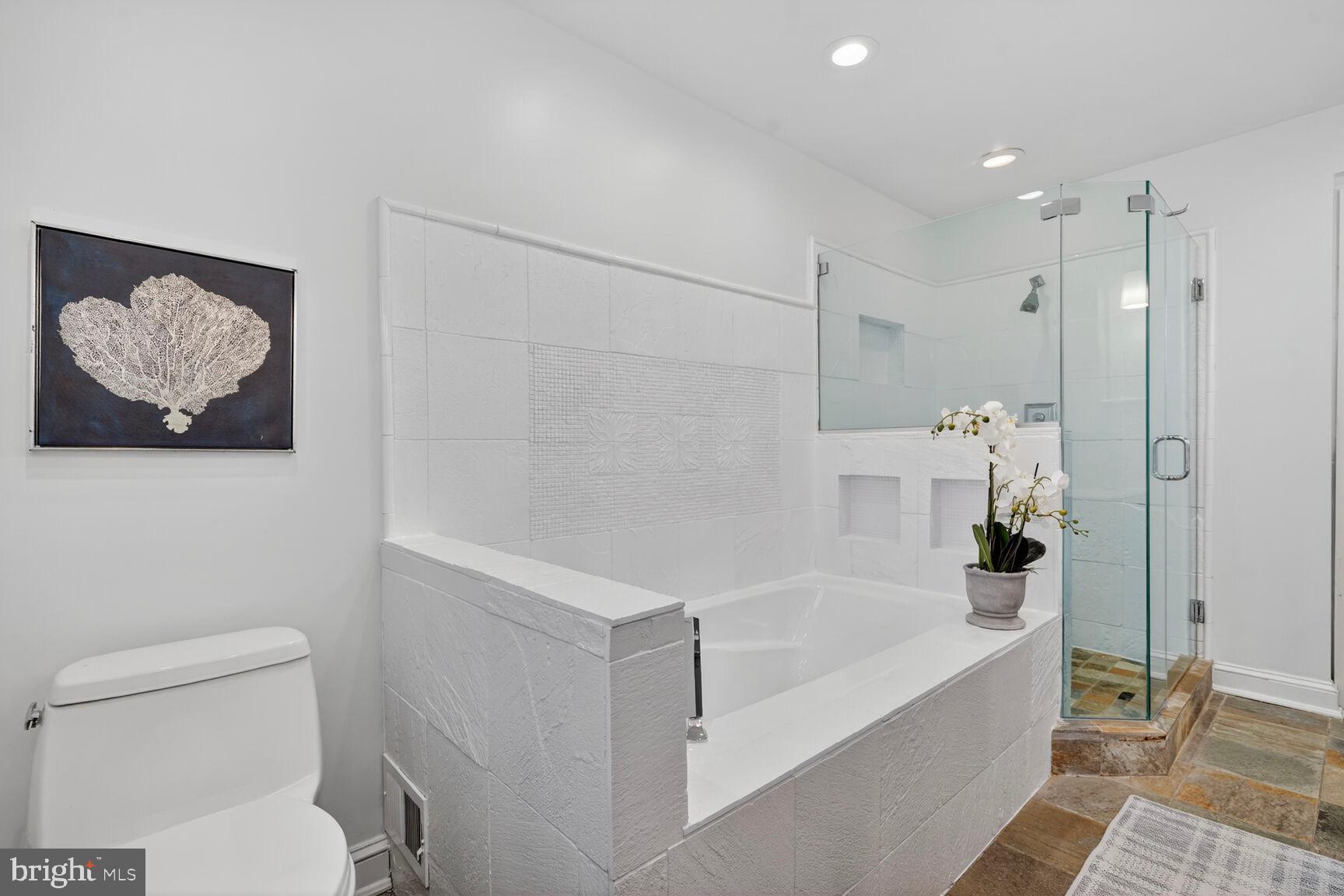 3262 Aberfoyle Place Northwest Washington, DC 20015 - Photo 31 of 64 a white bath tub sitting next to a toilet