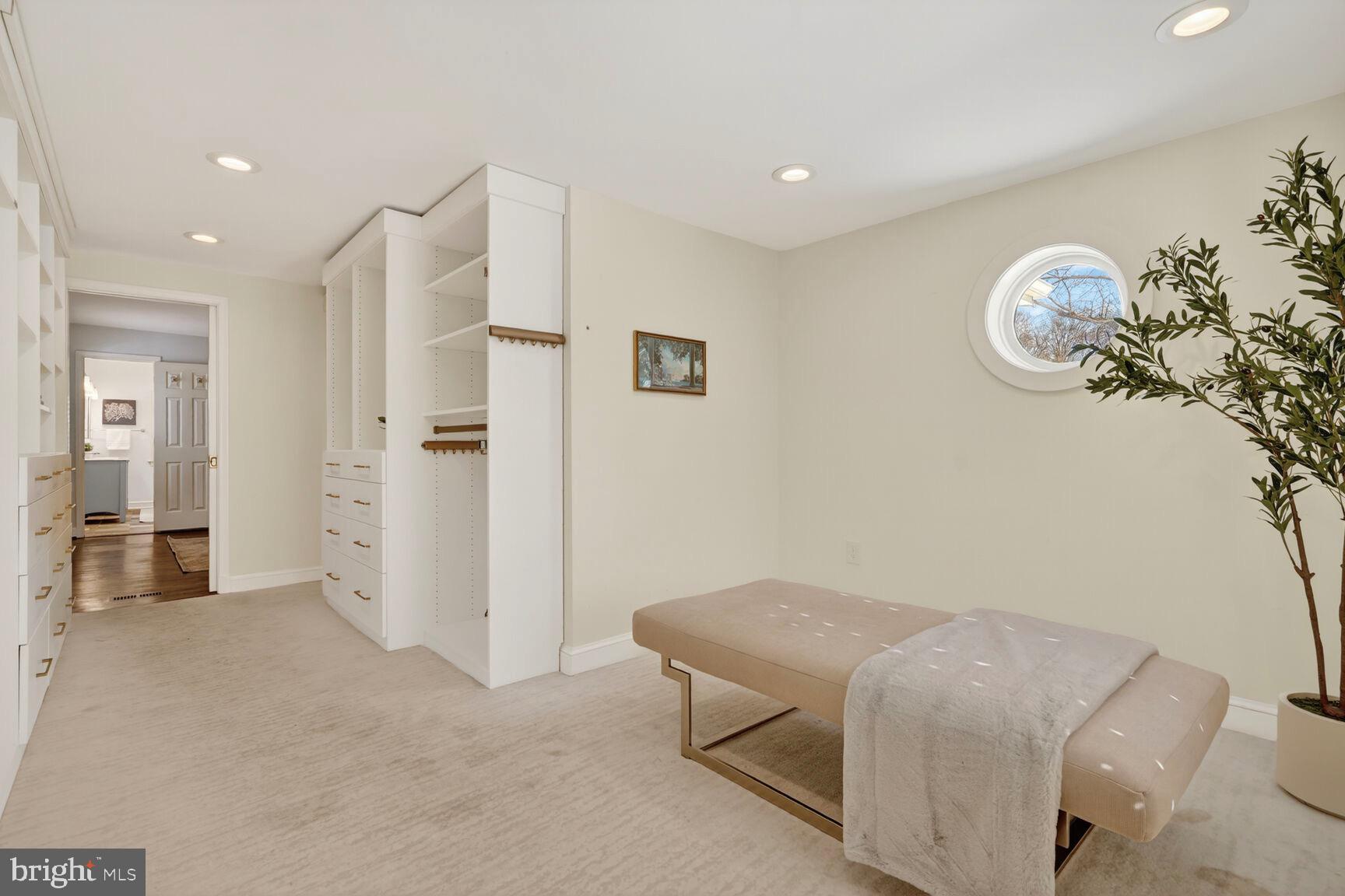 3262 Aberfoyle Place Northwest Washington, DC 20015 - Photo 34 of 64 a bedroom with a bed and a chandelier