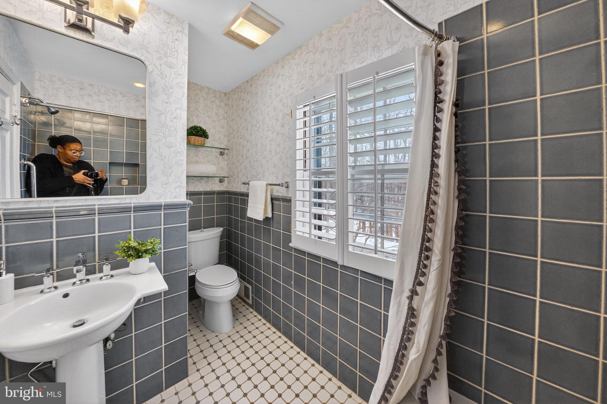 3262 Aberfoyle Place Northwest Washington, DC 20015 - Photo 40 of 64 a bathroom with a sink toilet and shower