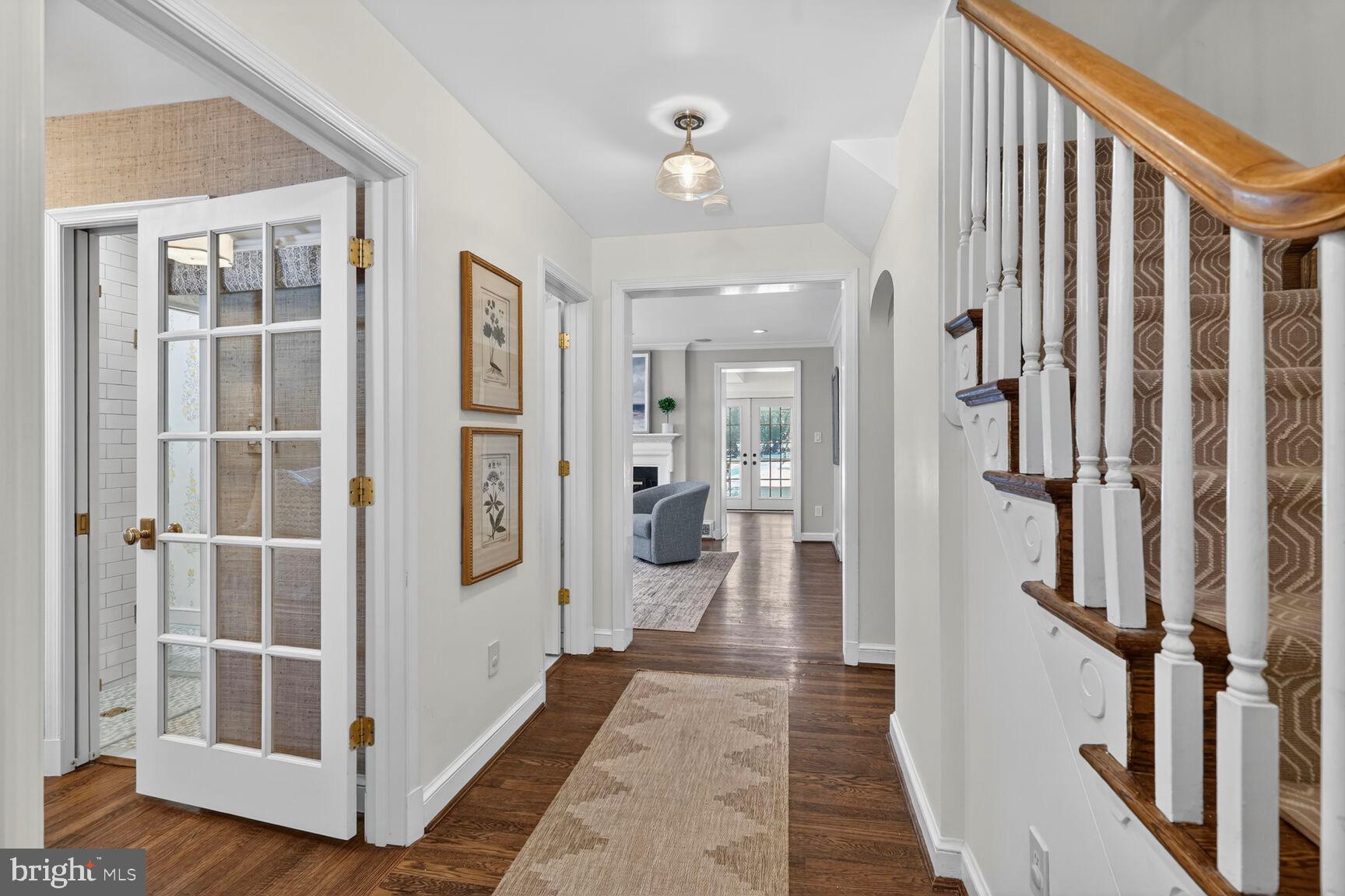 3262 Aberfoyle Place Northwest Washington, DC 20015 - Photo 4 of 64 a view of a hallway with wooden floor and windows