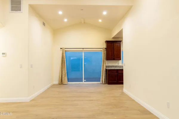 a view of an empty room with a bathroom