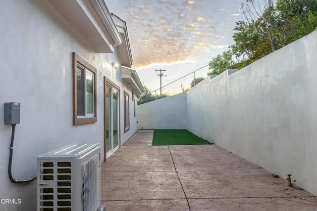 a backyard of a house with lots of green space