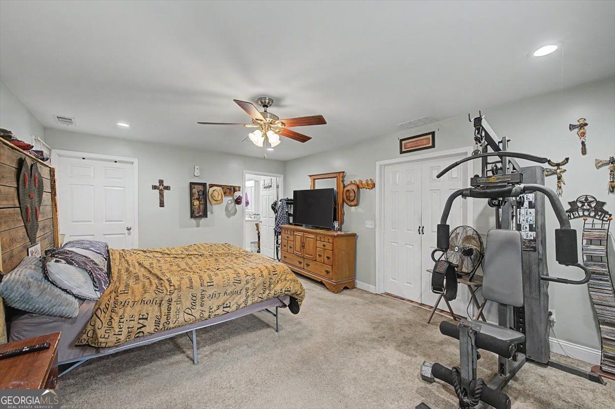 483 Coal Road Northwest Resaca, GA 30735 - Photo 27 of 56 a bedroom with a bed and a walk in closet