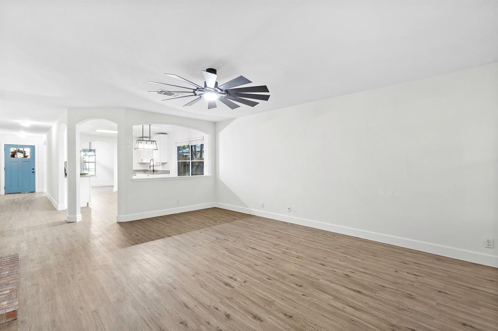 617 Barbara Way Bastrop, TX 78602 - Photo 20 of 20 An open floorplan with natural wood-look flooring flows seamlessly, offering a bright and versatile living space.