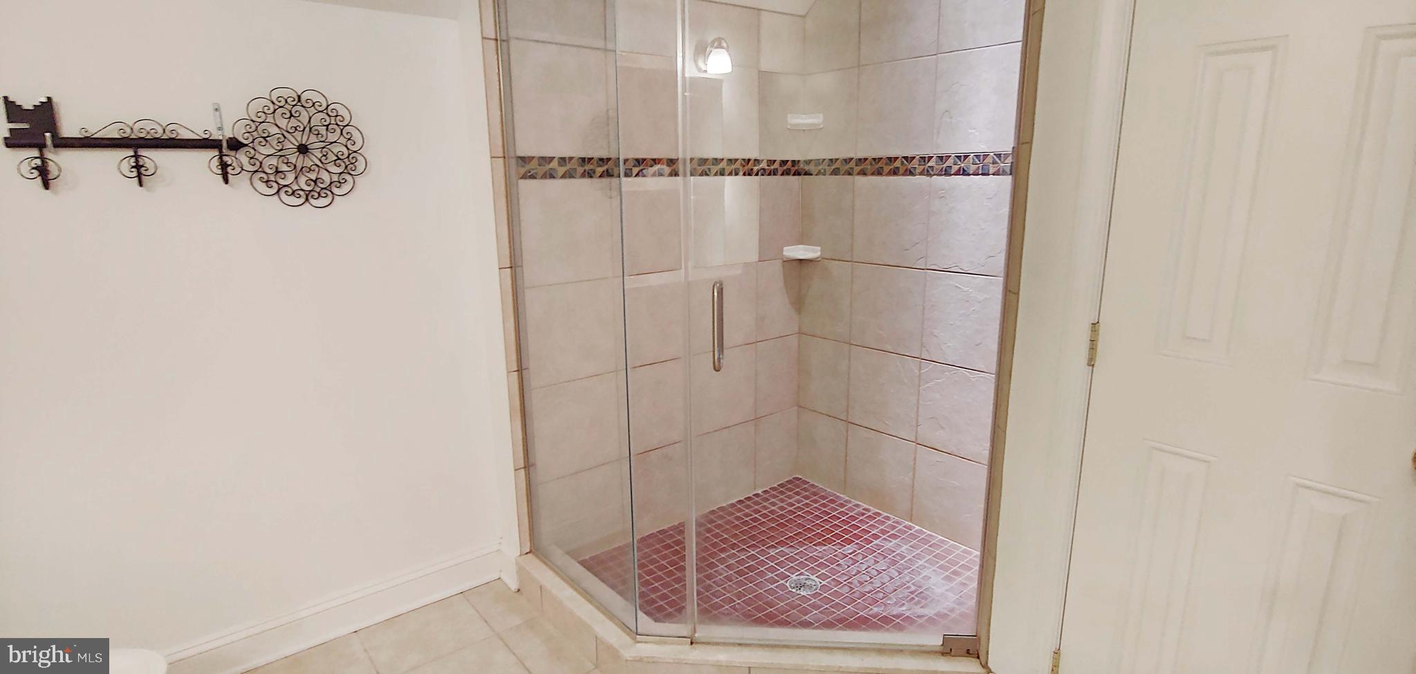 17451 Poplar Street Piney Point, MD 20674 - Photo 45 of 67 Large Tiled Shower with Frameless Glass