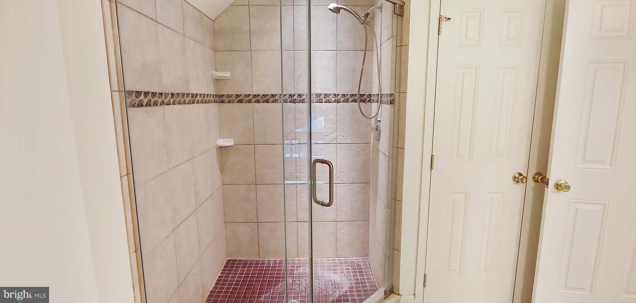 17451 Poplar Street Piney Point, MD 20674 - Photo 46 of 67 Large Tiled Shower with Frameless Glass