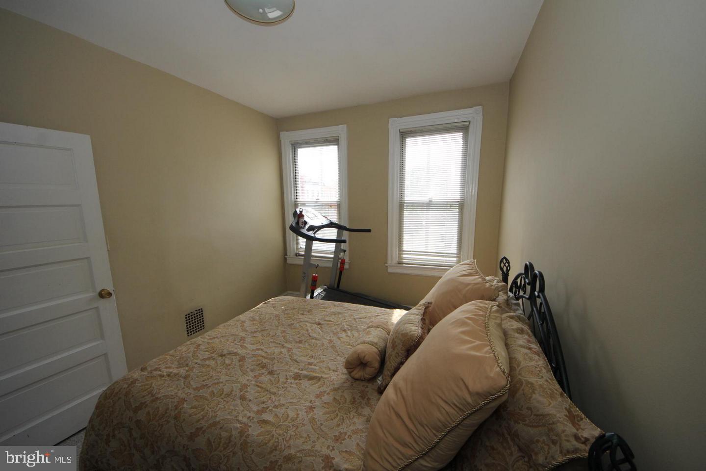 1932 Summit Place Northeast Washington, DC 20002 - Photo 13 of 26 a bedroom with a bed and window