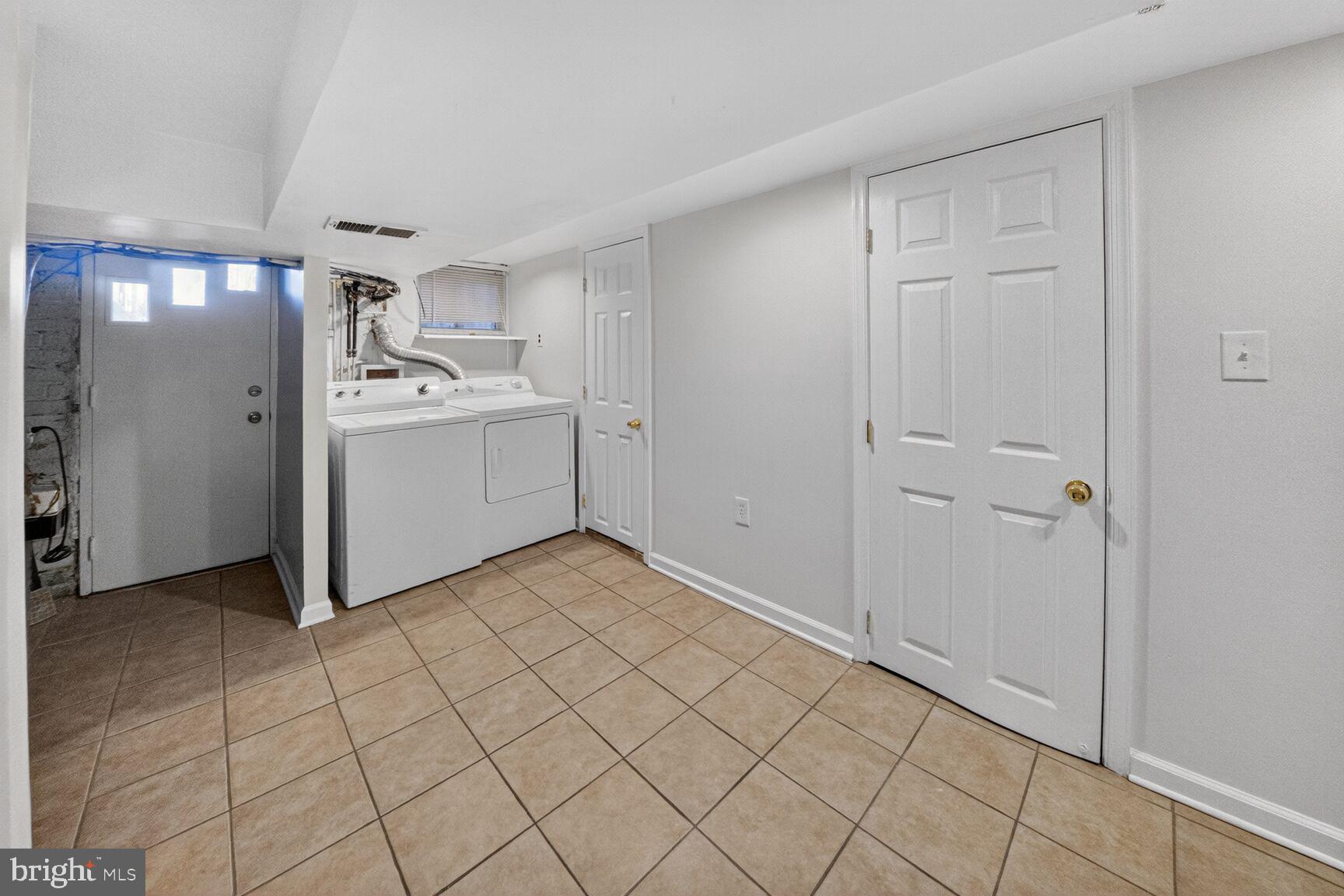 1932 Summit Place Northeast Washington, DC 20002 - Photo 20 of 26 a room view with a wooden cabinets and utility room