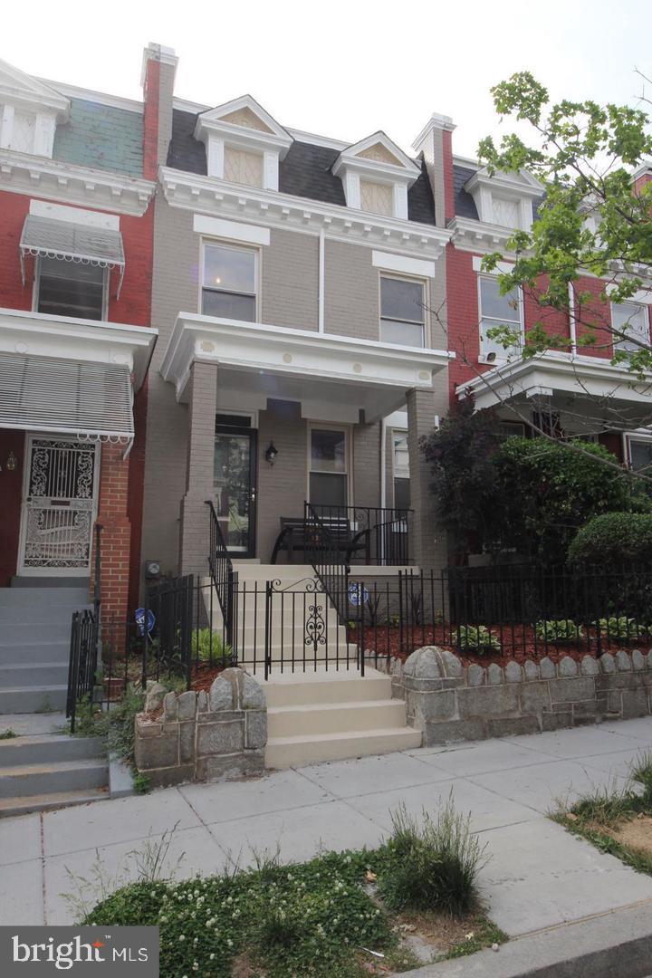 1932 Summit Place Northeast Washington, DC 20002 - Photo 26 of 26 a front view of a building with a yard