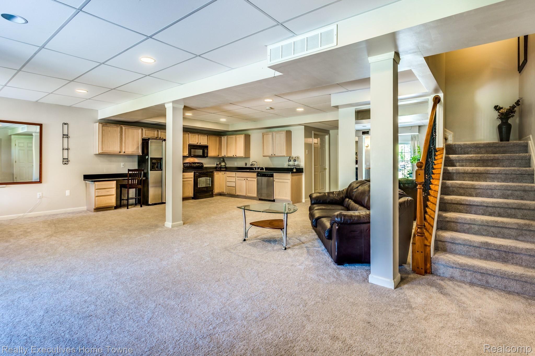 4224 Wincrest Lane Rochester, MI 48306 - Photo 53 of 74 Recreation room and kitchen in walk-out basement.