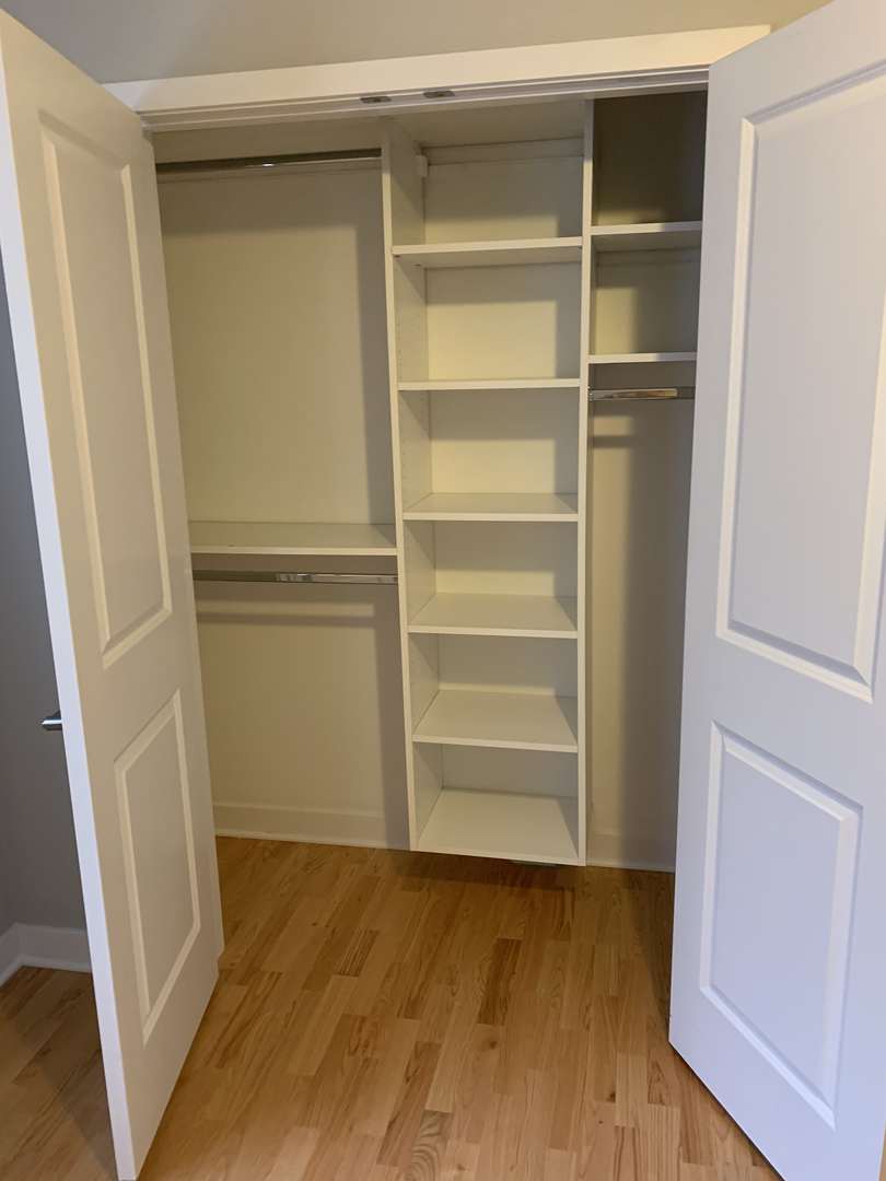 6125 North Clark Street, Unit 104 Chicago, IL 60660 - Photo 20 of 25 a view of walk in closet with empty racks