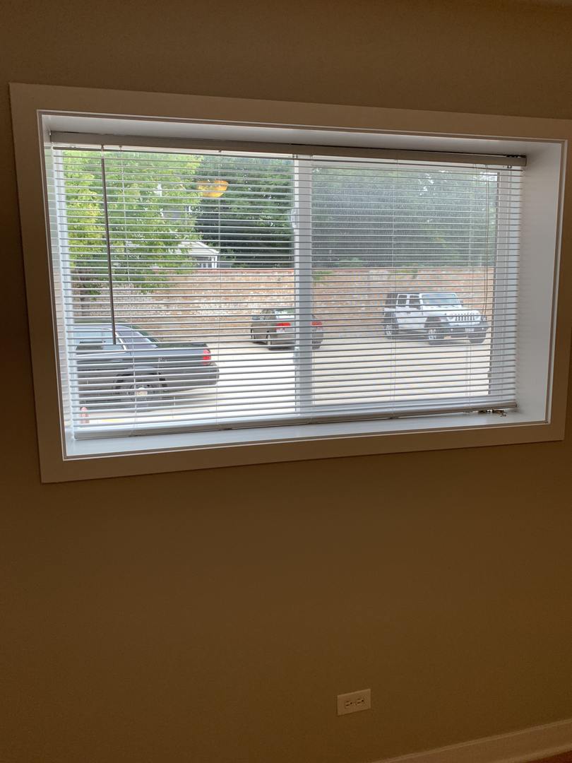 6125 North Clark Street, Unit 104 Chicago, IL 60660 - Photo 21 of 25 a view of a glass door with a view of the house