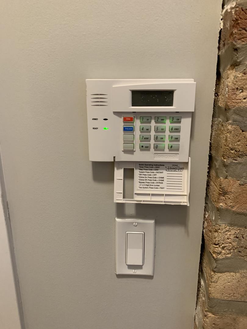 6125 North Clark Street, Unit 104 Chicago, IL 60660 - Photo 23 of 25 a view of kitchen cabinetry a sink and a window
