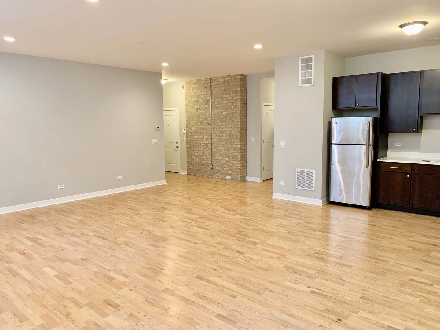 6125 North Clark Street, Unit 104 Chicago, IL 60660 - Photo 6 of 25 a view of empty room with wooden floor